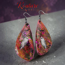 Load image into Gallery viewer, Close-up of a pair of glittery teardrop earrings with a white ghost and black spiderweb details