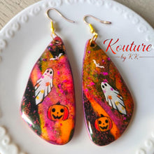 Load image into Gallery viewer, Pair of colorful teardrop Halloween earrings featuring a ghost, bat, and pumpkin on a black background
